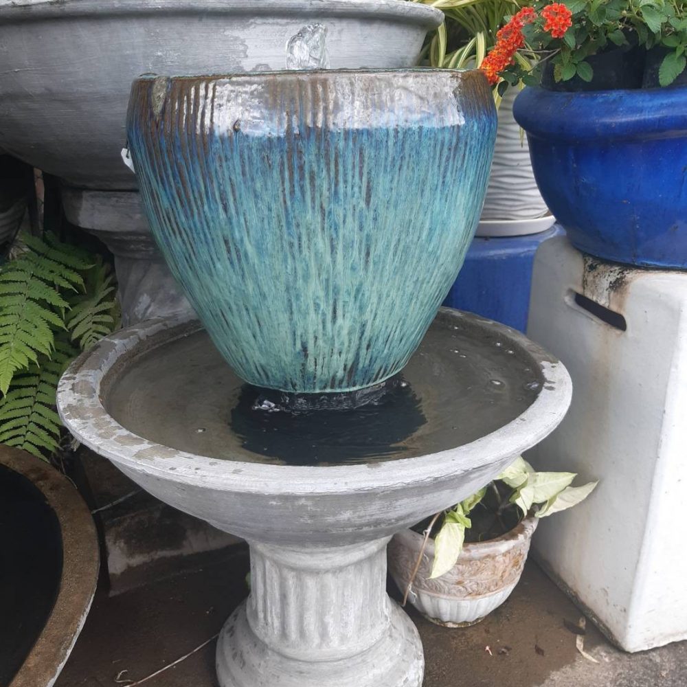 Overflowing water jar blue and brown tone