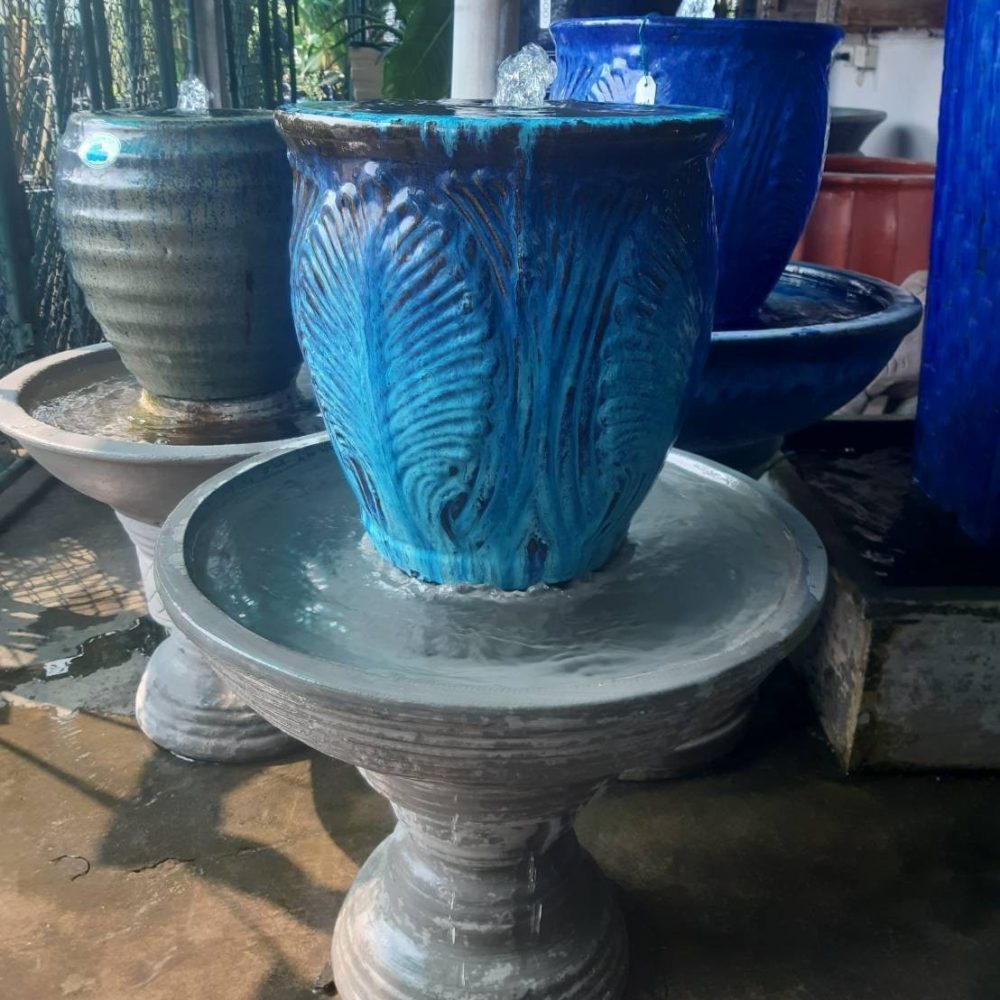 Overflowing water jar blue tone with leaf pattern