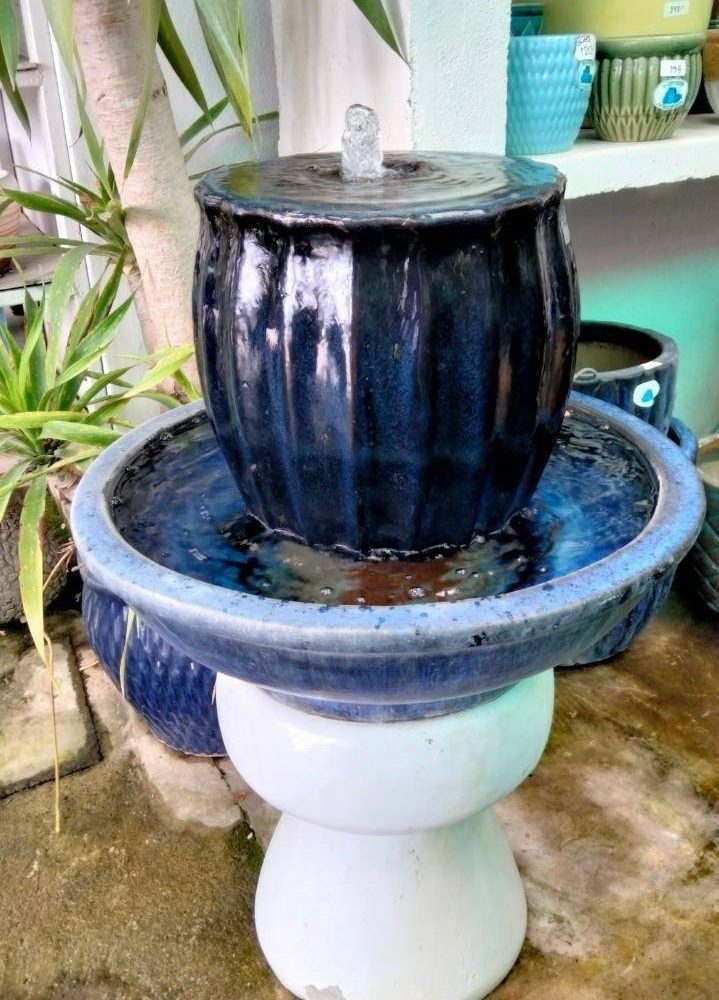 Overflowing water jar dark blue tone