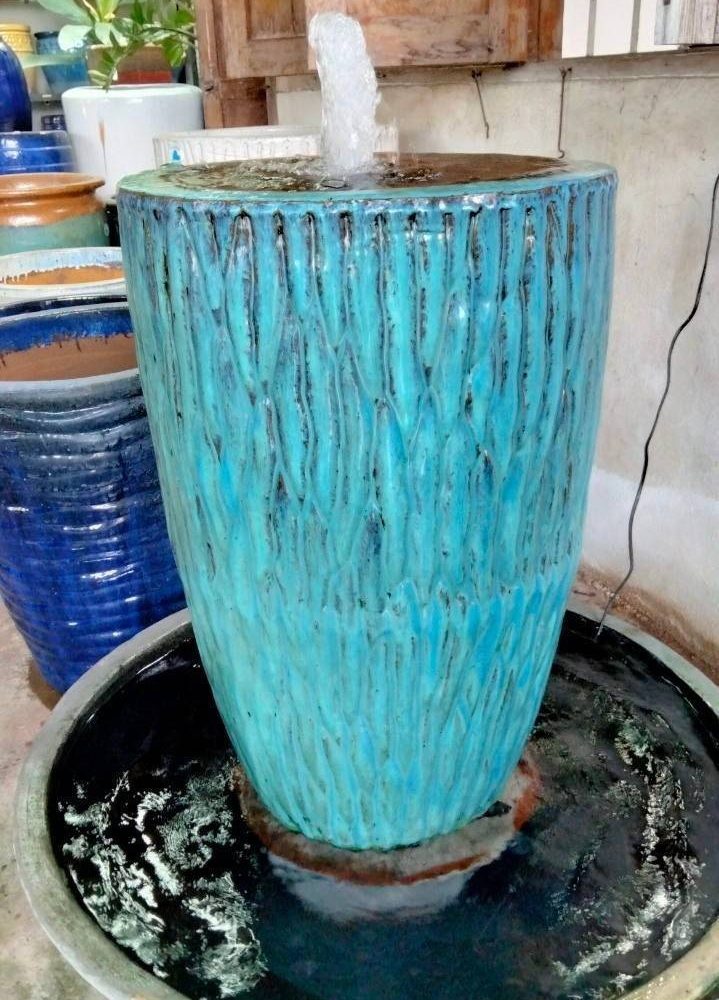 Overflowing water jar wave pattern tall shape
