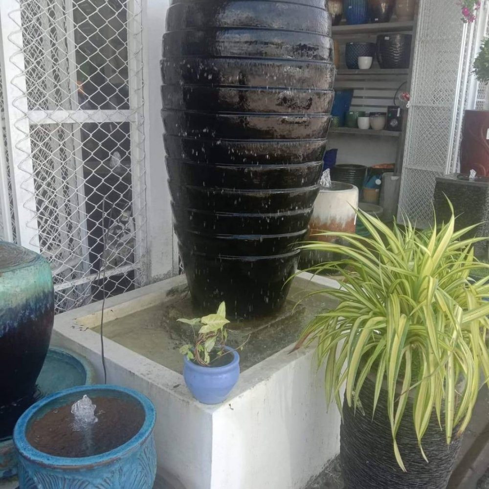 Overflowing water jar, black tones, wave pattern