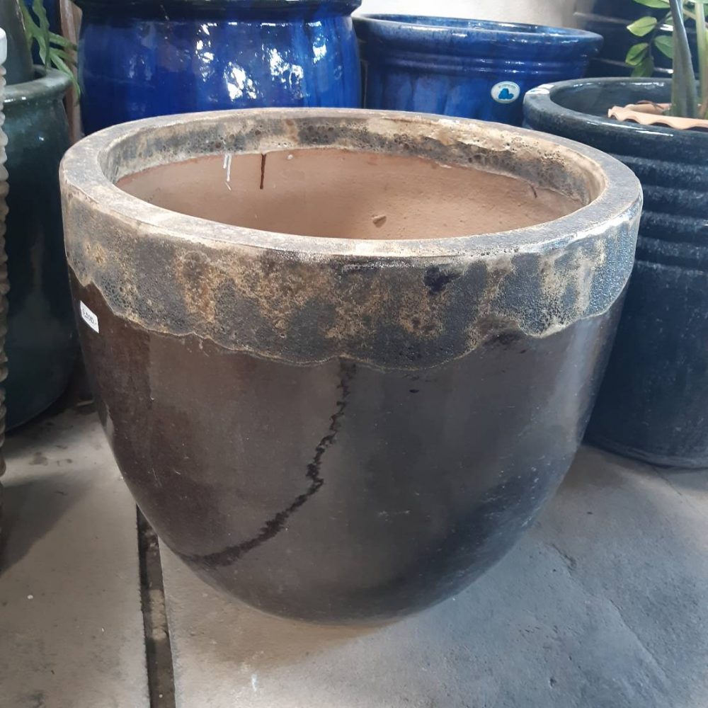 Rust-colored rim ceramic planter in brown tones