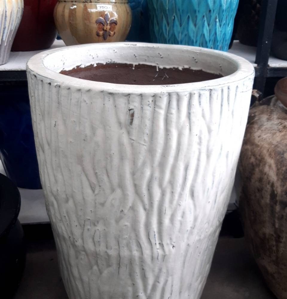 White ceramic planter with plant pattern