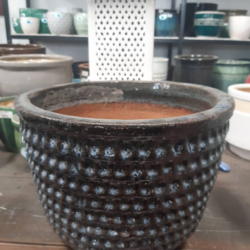 Ceramic pot with low relief pattern