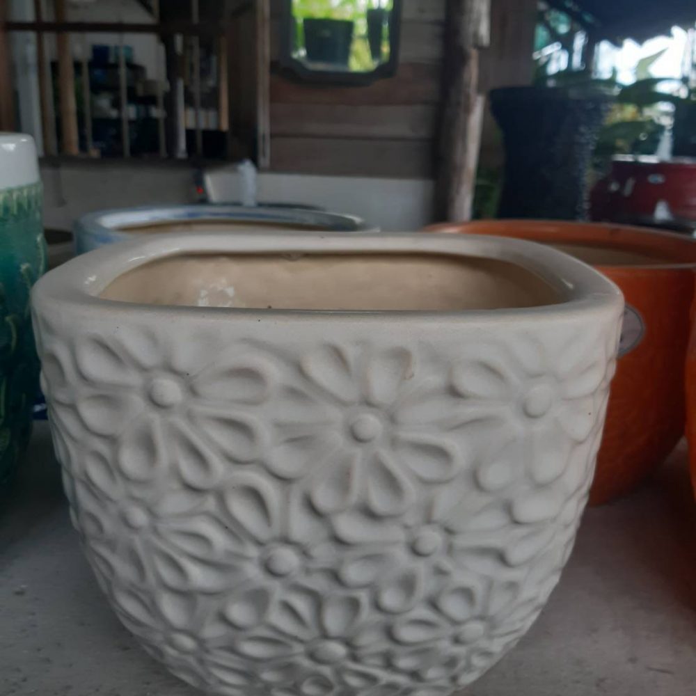 Ceramic flower planter with daisy pattern