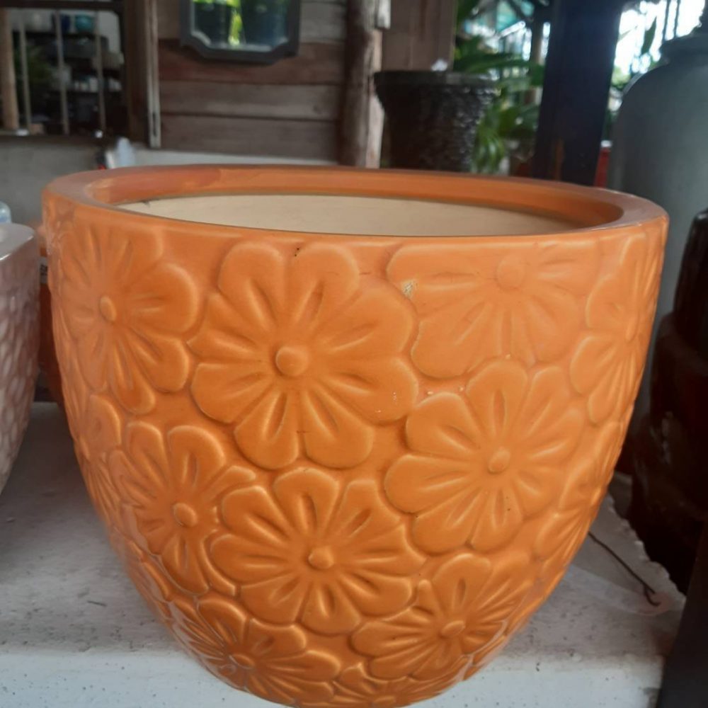 Ceramic flower planter with blooming flowers