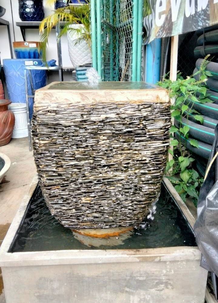 Overflowing water cladding stone with square shape